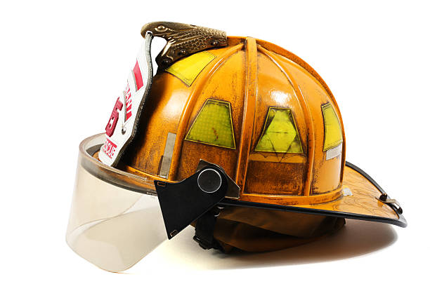Firefighter's helmet Yellow firefighter's helmet with firefighter shield with Lieutenant, 35 and Fire-Rescue on it. helmet stock pictures, royalty-free photos & images