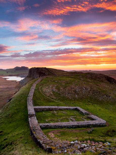 Firery sunrise over Milecastle 39 on Hadrian's Wall. Firery sunrise over Milecastle 39 on Hadrian's Wall. northumberland stock pictures, royalty-free photos & images