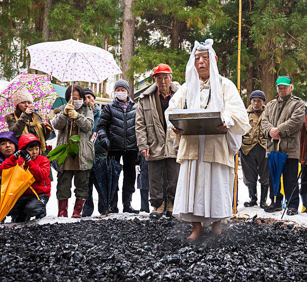 Firewalking at Shinto Ceremony Nagano, Japan - February 4, 2013: Shinto Ascetics perform ancient purifying rites. Known as Yamabushi, they are mountain hermits with a long tradition of mysticism. firewalking stock pictures, royalty-free photos & images