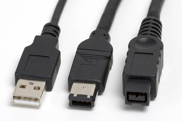 USB, FireWire 6 and 9-pin plugs stock photo