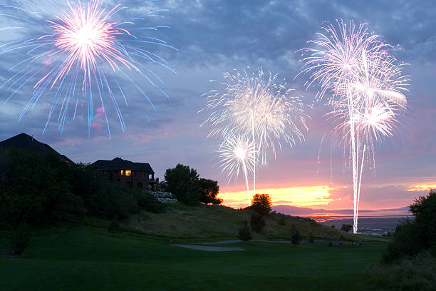 Fireworks at Sunset Over Golf Course stock photo