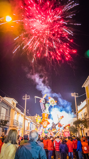Cullera, Valencia / Spain - 02 17 2017: Spectators watching fireworks celebration of the Falla Raval- winner in the competition during Las Fallas festival in Cullera, Valencia, Spain.