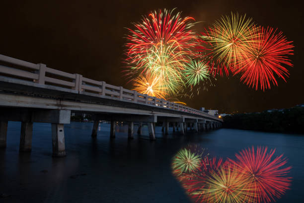 Fireworks over bridge over Hickory Pass leading to the ocean stock photo
