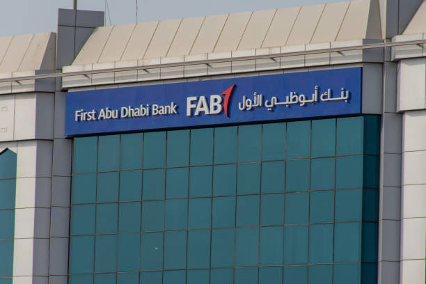 First Abu Dhabi (FAB) Bank blue storefront on a blue sky sunny day stock photo