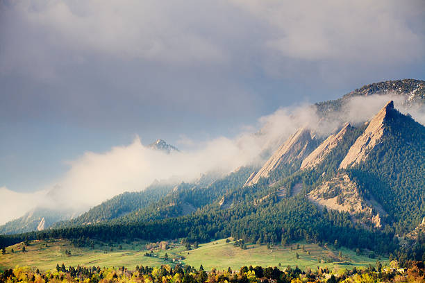First Light on the Boulder Colorado Flatirons First Light on the Boulder Colorado Flatirons as a storm clears. boulder colorado stock pictures, royalty-free photos & images