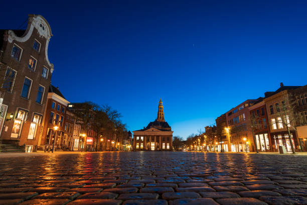 Fish Market Groningen GRONINGEN - THE NETHERLANDS: March 21, 2020: Empty square (Vismarkt) during  the corona crisis in the city of Groningen. groningen city stock pictures, royalty-free photos & images