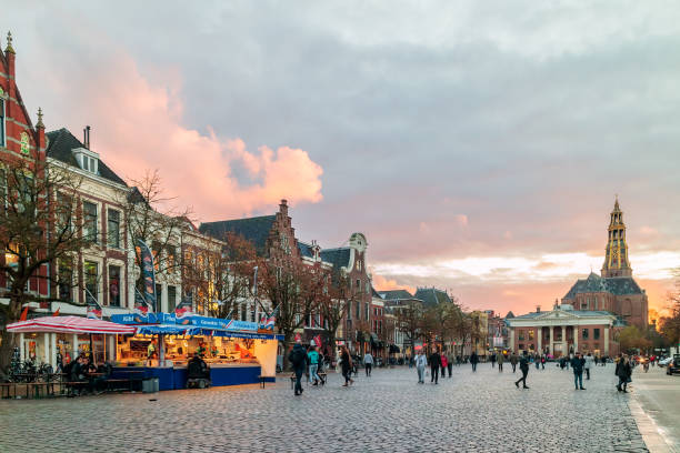 Fish market stall on the Dutch Vismarkt square during sunset in Groningen Groningen, The Netherlands – November 2, 2017: Fish market stall on the Dutch Vismarkt square during sunset in Groningen, The Netherlands groningen city stock pictures, royalty-free photos & images