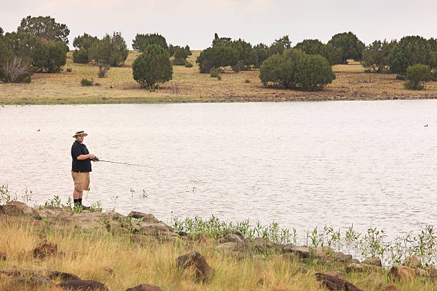 Fisherman Fishing Kinnikinick Lake Arizona stock photo
