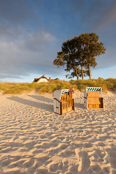 Fisherman's house in the dunes on the beach of Ahrenshoop, Baltic Sea stock photo