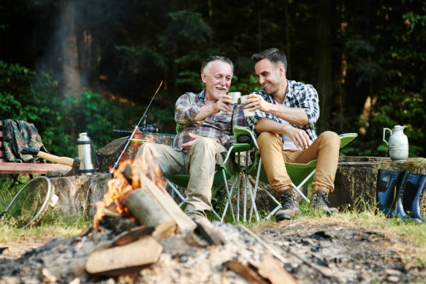 Fishermen drinking coffee beside bonfire Fishermen drinking coffee beside bonfire fisher role photos stock pictures, royalty-free photos & images