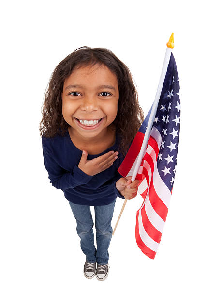 Fisheye Young Girl With American Flag A beautiful Puerto Rican girl holding an American Flag with and placing her hand over her heart. cute puerto rican girls stock pictures, royalty-free photos & images