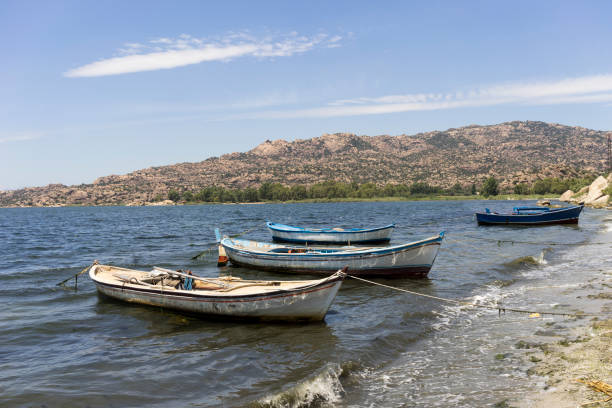 Fishing Boat and Fishermen on Lake Bafa in Heraklia Milas Bodrum Mugla Turkey stock photo