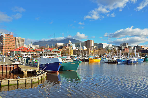 Fishing Boats Moored to the quay in Hobart Harbour View of Hobart harbour with Mount Wellington in the background on a clear winter Day, Tasmania, Australia tasmania photos stock pictures, royalty-free photos & images