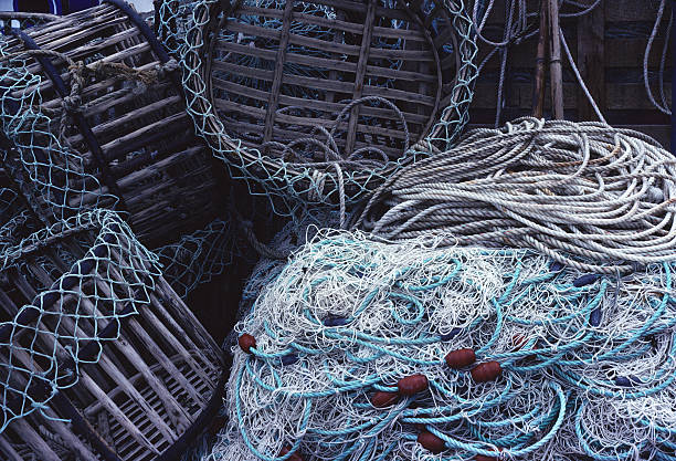 Fishing Nets and Traps, France Fishing nets and traps in the town of Audierne, France on the Brittany coast. finistere stock pictures, royalty-free photos & images