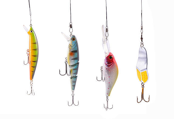 fishing wobblers four fishing wobblers isolated on white background hook stock pictures, royalty-free photos & images