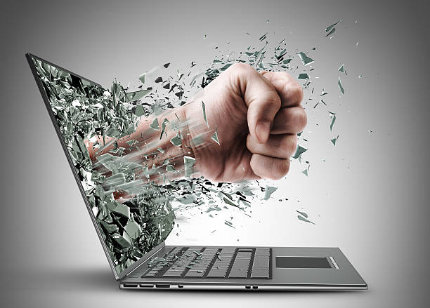 Fist from laptop stock photo