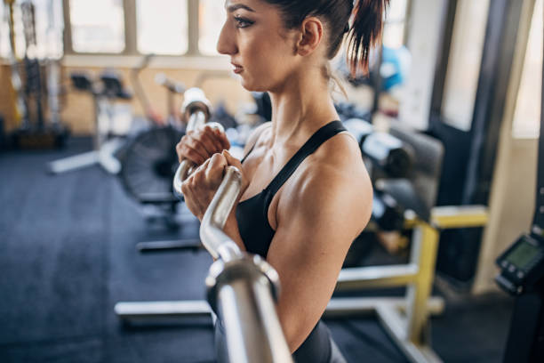 Fit woman training in gym stock photo