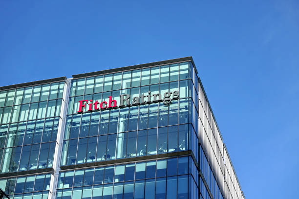 Fitch Ratings logo signage at top of their Headquarters in UK stock photo