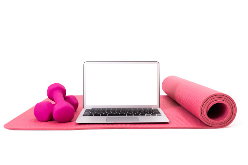 dumbbells and yoga mat,laptop computer.  with clipping path.