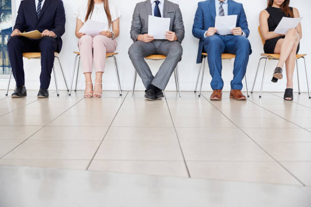 Five candidates waiting for job interviews, front view, crop Five candidates waiting for job interviews, front view, crop candidate stock pictures, royalty-free photos & images