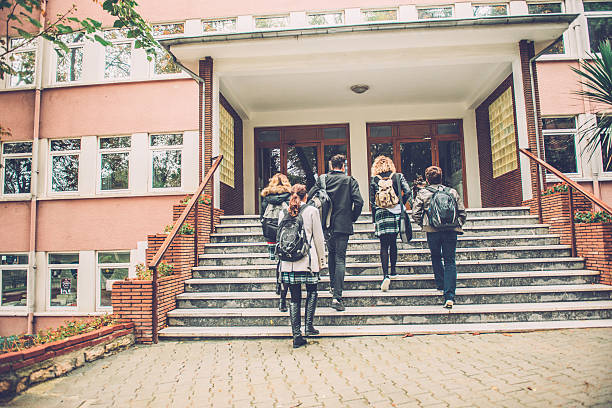 Five Turkish Students Going to School, Istanbul Five Turkish students walking to school. They are ascending the staircase, outdoors, campus. Cold autumnal morning. Nikon D800, full frame, XXXL. high school building stock pictures, royalty-free photos & images