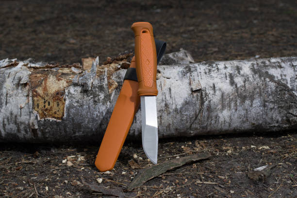 Fixed blade knife. Knife with orange handle and plastic sheath. Fixed blade knife. Knife with orange handle and plastic sheath. Orange case and knife. bushcraft stock pictures, royalty-free photos & images