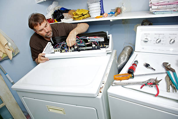 Fixing a Clothes Dryer stock photo