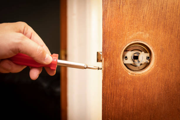 Fixing a doorknob stock photo