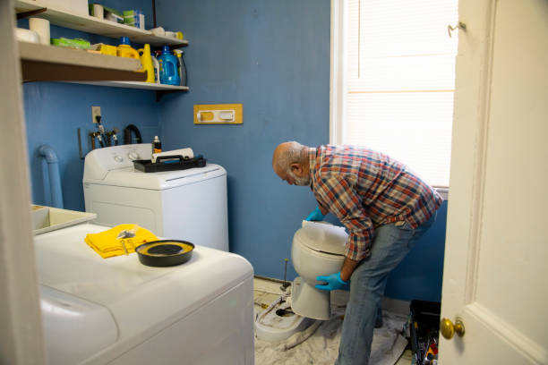 Fixing up the bathroom and laundry room in an old house. stock photo
