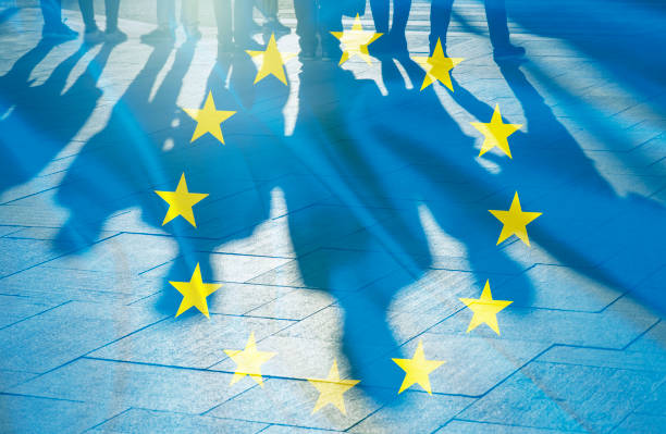 EU Flag and shadows of People concept picture stock photo