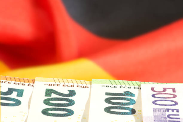 Flag of Germany and Euro banknotes stock photo