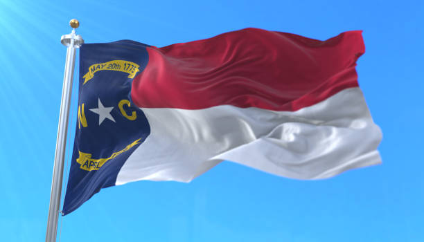 Flag of North Carolina state, region of the United States Flag of american state of North Carolina, region of the United States, waving at wind north carolina us state photos stock pictures, royalty-free photos & images