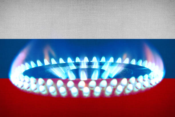 Flag of Russia and a gas flame stock photo
