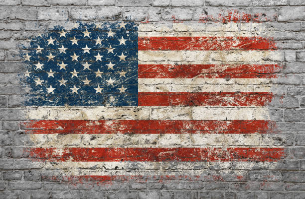 Flag of USA painted on brick wall Grunge distressed flag of USA painted on old weathered grey brick wall flag photos stock pictures, royalty-free photos & images