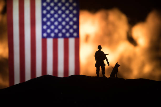 Flag on burning dark background. Concept of crisis of war and political conflicts between nations. Selective focus stock photo