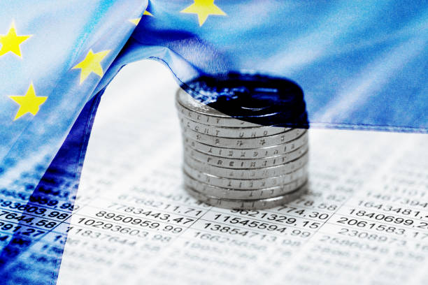 EU flag, spreadsheet and euro coins stock photo