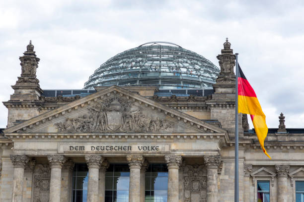 Flags on the background of the Reichstag building Berlin, Germany - July 01, 2018: Flags on the background of the Reichstag building bundestag stock pictures, royalty-free photos & images