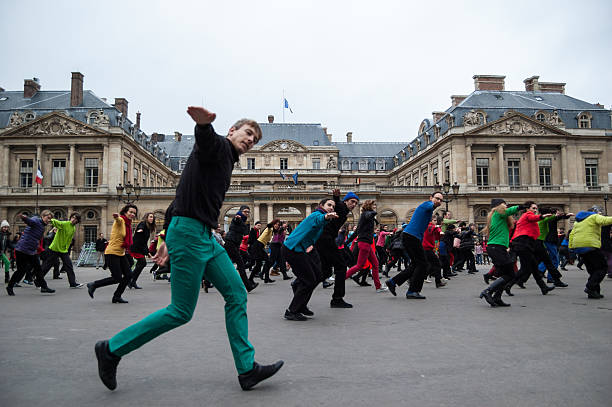 Flash mob. People dance at Palais Royal square. stock photo