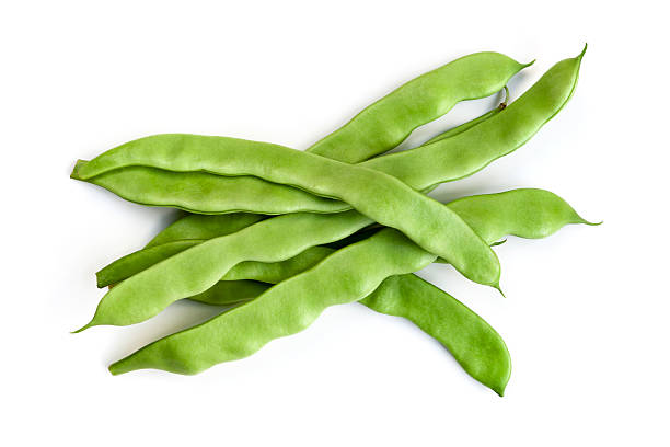 Flat Beans Isolated Flat beans isolated on white background. runner bean stock pictures, royalty-free photos & images
