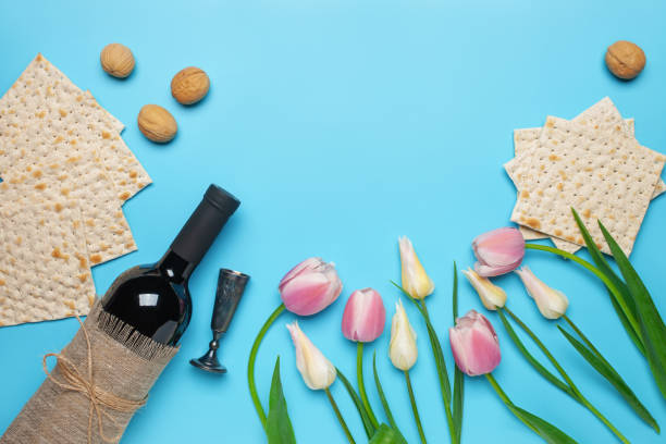 Flat lay composition with matzos on color background. Top view. Passover (Pesach) festive stock photo