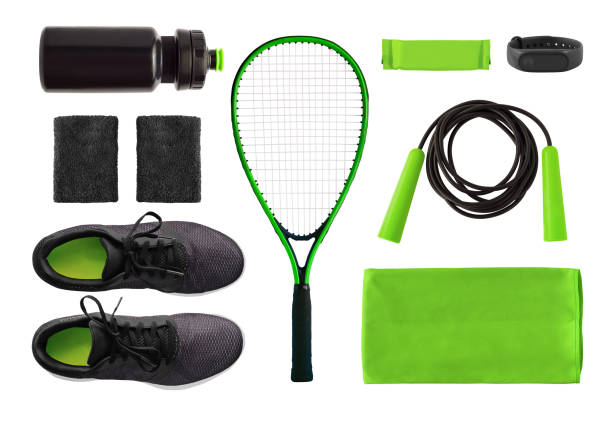 Flat lay of sport accessories and equipment isolated Flat lay of sport accessories and equipment for training. Running shoes, tennis racket, jump rope etc. isolated on white background sporting goods stock pictures, royalty-free photos & images