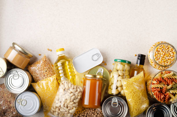 Flat lay view at kitchen table full with non-perishable foods. Spase for text Flat lay view at kitchen table full with non-perishable foods. Spase for text legume family photos stock pictures, royalty-free photos & images