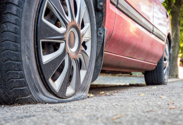 Flat tire on the roadside stock photo