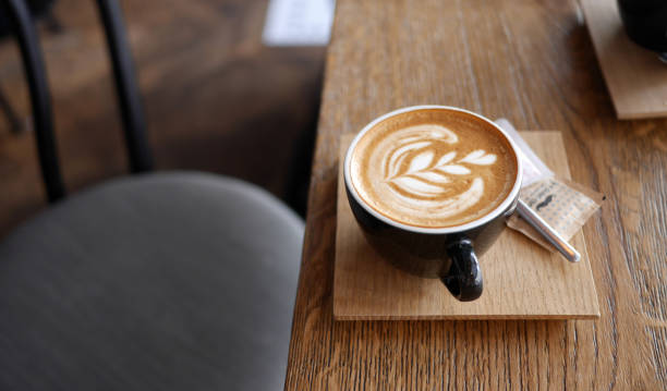 Flat White Coffee Flat white coffee in modern coffee shop coffee break stock pictures, royalty-free photos & images