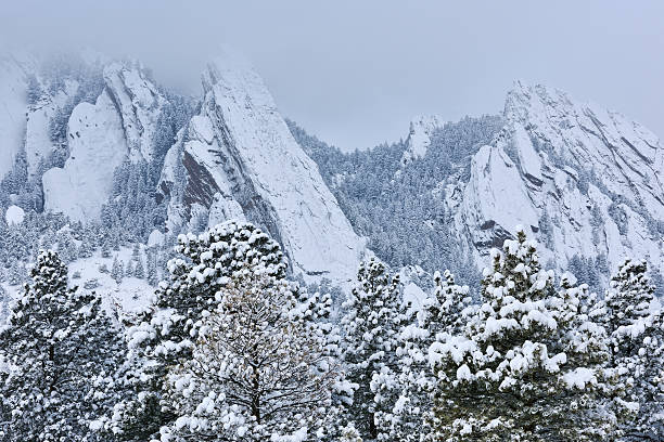 Flatirons Snow Flocked Winter landscape of the Flatirons flocked with snow, Rocky Mountains, Boulder, Colorado, USA  boulder colorado stock pictures, royalty-free photos & images