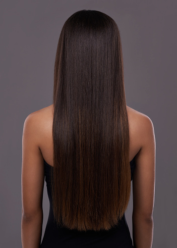 Rear view of a young woman with beautiful long hair