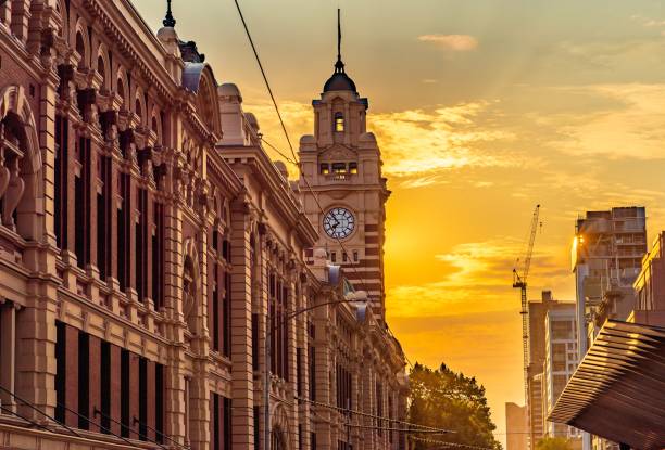 Flinders Street Clock The clock tower of the Flinders Street Train Station in the city of Melbourne, Australia in the late afternoon sun melbourne street stock pictures, royalty-free photos & images