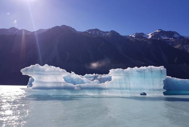Floating Glacier on Lake with Sun Glare stock photo