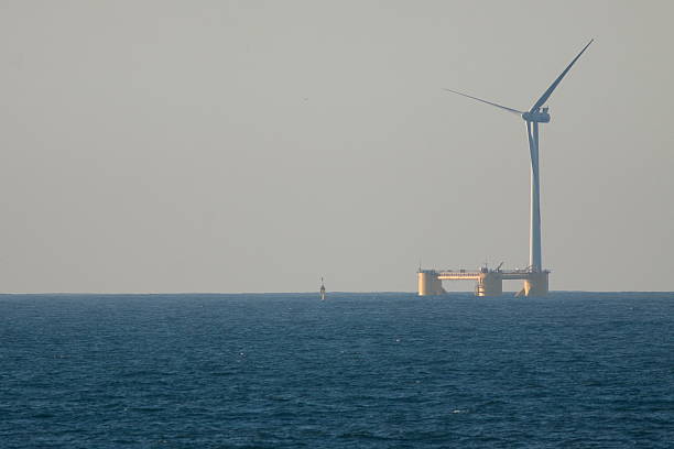 Floating Wind Turbine Floating wind turbine installed 4 km offshore of Agucadoura, Povoa de Varzim, Portugal in October 2011. Was the first offshore wind turbine deployed without the use of any offshore heavy lift vessels. Additionaly this is the first offshore wind turbine instaled in the Atlantic waters and make use of a semi-submersible type floating foundation. vertical axis wind turbine stock pictures, royalty-free photos & images