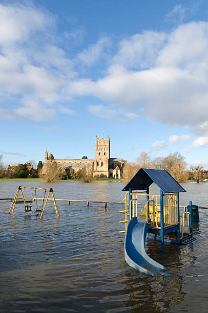 Flood water, Tewkesbury Abbey, Gloucestershire stock photo